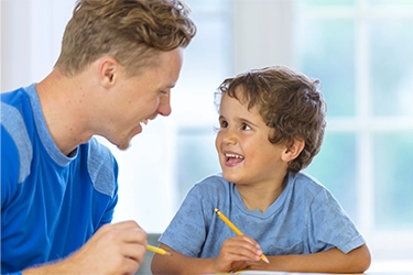 Pre-K student learning letter forming with DittoSheets